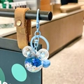 Blue Mickey-shaped liquid quicksand keychain featuring floating stars and matching bell - Blue Mickey Head Sparkle