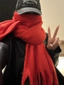 Soft red mohair scarf with fringe detail worn by a model in a casual indoor setting - Red