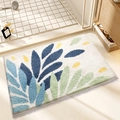 Absorbent blue and green leaf patterned flocking bathroom mat in a shower room setting - Dancing Leaves