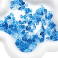 Irregular blue and clear acrylic beads in a white ceramic dish for DIY jewelry making - Transparent Dark Blue