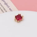 Macro shot of square-cut red zircon pendant in a gold four-prong setting for DIY jewelry - Rose Red