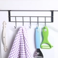 Over-door 5-hook rack in silver stainless steel hanging on a kitchen cabinet door - 5-Hook Row / Silver