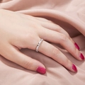 Close-up of a silver ring with heart-shaped cubic zirconia on a hand with red nails - Heart Style (SE897)