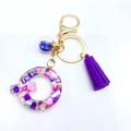 Letter Q resin keychain with purple glitter, pink stones, tassel and golden clasp - Letter Q