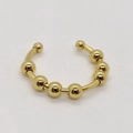 Foto macro de anillo antiansiedad dorado con cuentas giratorias ajustables - Abierto Ajustable / Dorado