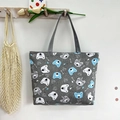 Grey canvas tote bag featuring blue and white cartoon bear prints on a wooden hook - Grey Dog