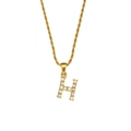 Golden twist chain necklace featuring a sparkling letter H pendant with zircon stones - Letter H