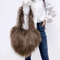 Close-up of fluffy brown faux fur hobo bag showing long plush texture and glossy finish - Brown
