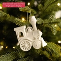 White glittery train Christmas tree ornament hanging on branch with warm LED lights - White Glitter Little Train-D
