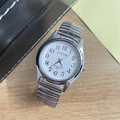 Detailed top view of a quartz watch with a white dial and silver elastic steel band - Men's Watch / Silver White Dial