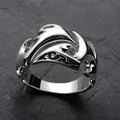 Macro shot of silver ring with 3D cloud pattern on dark stone background - Style 2-Dolphin Pattern