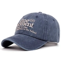 Detail of embroidered 'One Moment' lettering on vintage navy blue cotton baseball cap - Adjustable / Navy Blue