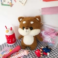Cute brown Shiba Inu plush crossbody bag with a metal chain strap on a desk - No Accessories / Bare Bag