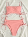 Pink high-waisted two-piece bikini with side cut-outs and bow tie accents - S / Pink