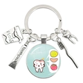Dental-themed keychain with toothbrush, toothpaste, and glass pendant on a silver ring - Acidic Foods Impact (39)