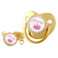 Detailed view of a golden baby pacifier with rhinestones, crown pattern and Princess text - 2-Gold Princess (Pink)
