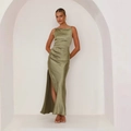 Detailed view of sage green satin midi dress featuring a side slit and elegant ruching - S / Green