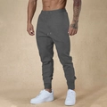 Pantaloni sportivi da uomo grigio scuro con coulisse e polsini a costine slim fit - S / grigio scuro
