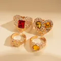 Retro 4-piece gold-plated heart ring set featuring colorful resin gemstones and texture - Four-Piece Set / Gold