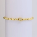 Elegant 18k gold beaded bracelet featuring a cubic letter D pendant with white crystals - Letter D