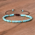 Adjustable woven bracelet featuring turquoise disc beads and golden metal spacers - No.31 Blue Turquoise