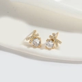 Eleganti orecchini a lobo a fiocco in oro 18K con una pietra preziosa tonda e brillante - Zirconia Incrociata
