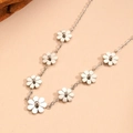 Polished stainless steel necklace featuring multiple daisy flower charms on a fine metal chain - Silver Daisy Necklace (B312)