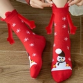 Christmas magnetic socks in red with snowman patterns and 3D reindeer antlers detail - Red Snowflake Snowman