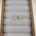 Four-prong natural clear crystal stud earrings with gold plating in a jewelry box - Moonstone