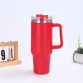 Detail of red 40oz insulated tumbler featuring ergonomic handle and transparent lid - Red (Generation 1)