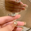 Adjustable silver star ring with shimmering rhinestones and delicate chain detail - Adjustable Open / Star Chain Style (J3160)
