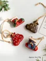 Set of 4 vintage resin Christmas charms with boots and bags on white background - Style D 4-Piece Set