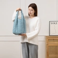 Detail shot of light blue bubble textured tote bag with 3D waffle fabric pattern - Blue