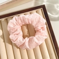 Pink floral lace scrunchie with pleated fabric in a wooden tray for elegant hair styling - Pink Seersucker