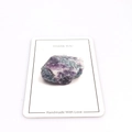 Macro shot of natural raw fluorite stone with purple and green textures on thank you card - Purple Green Fluorite