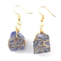 Close-up of handmade gold wire-wrapped dark blue raw natural stone earrings on white background - Gold + Blue Lace Agate
