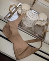 Short khaki cotton crop top with elastic back detail shown on a decorative tray - Dark Khaki Bralette