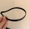 Minimalist black glossy headband with slim plastic frame for a modern hair styling - PC Black Hairband