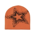 Detail of orange knit beanie featuring a black star jacquard and thick texture - M (56-58cm) / Orange