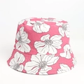 Close-up of pink bucket hat with white flower pattern and detailed stitching on the brim - Pink White