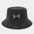 Close-up of black washed denim bucket hat with detailed white symmetrical embroidery - One Size / Black