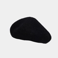Close-up of the soft fuzzy texture and knit details of this black wool blend beret hat - Black