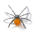 Macro shot of spider craft with silver legs and translucent amber gemstone body - Irregular Yellow Agate