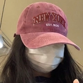 Close-up of vintage washed burgundy baseball cap featuring white New York embroidery - One Size / Burgundy