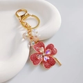Golden four-leaf clover keychain with pink rhinestones and clear crystal beads - Pink