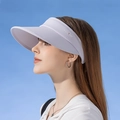 Light purple UPF 50+ wide brim sun visor hat for women worn by a model against blue sky - Light Purple