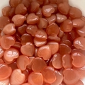 Stack of orange heart-shaped gemstones with cat eye effect for home decor - Orange Cat Eye