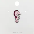 Cute pink seahorse enamel pin badge with purple fin and white belly detail on card - 145*Cute Pink Seahorse Pin