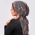 Detail of grey floral turban headscarf with orange blossoms and elegant fabric drape - Dark Grey with Pink Floral