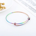 Detail view of rainbow gradient stainless steel wire bracelet on aesthetic background - Rainbow Color (KB163107)
